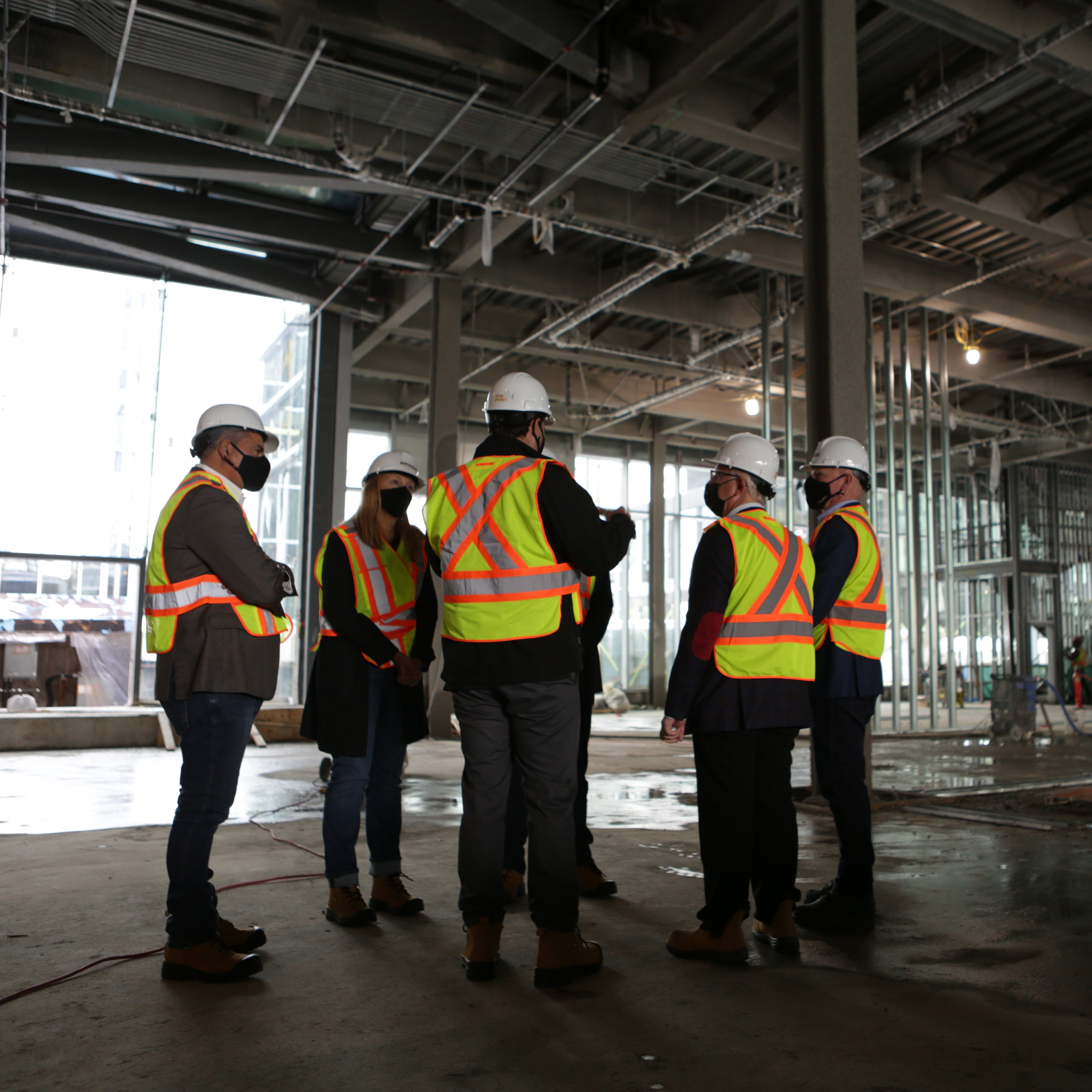 Group of construction workers in a building under construction