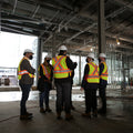 Group of construction workers in a building under construction
