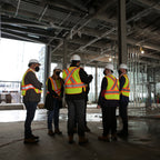 Group of construction workers in a building under construction