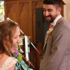Man and woman in wedding attire in a church setting