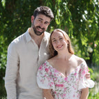 Man and woman standing together in a garden setting