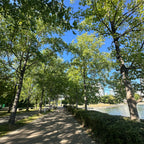 Your product, shot on at a tree lined waterfront walkway